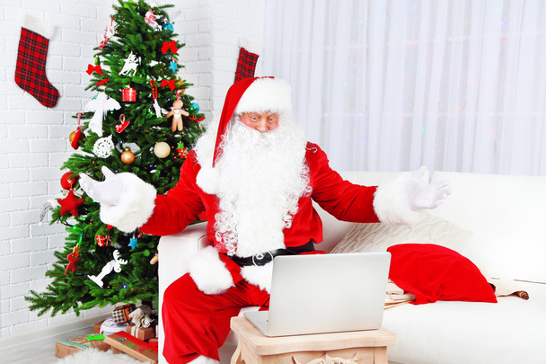 Santa Claus using computer - Photo, Image