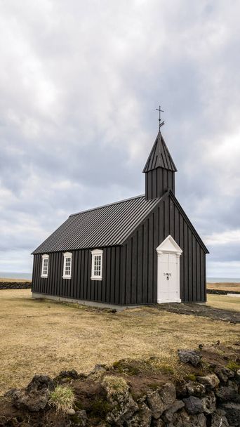Black church on the peninsula Snafellsnes , Budakirkja,Budir church in Iceland. - Photo, Image