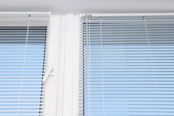 Window with horizontal blinds indoors, low angle view - Foto, imagen