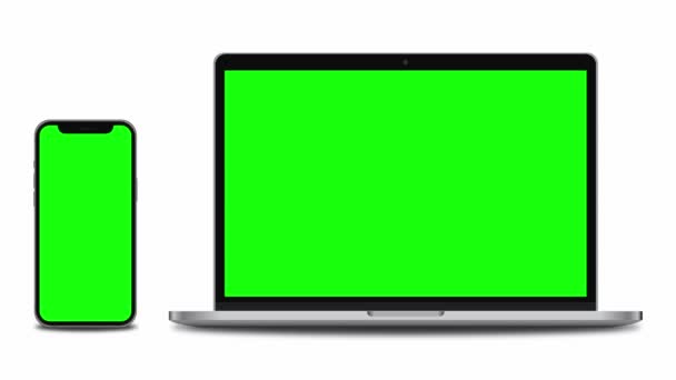Smartphone y laptop con pantalla verde. Animación 4K para presentación en pantalla de maqueta - Imágenes, Vídeo