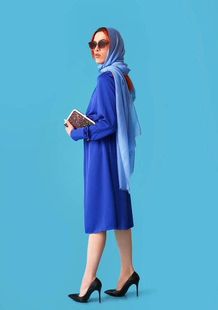 Stylish transgender woman on blue background - Fotó, kép