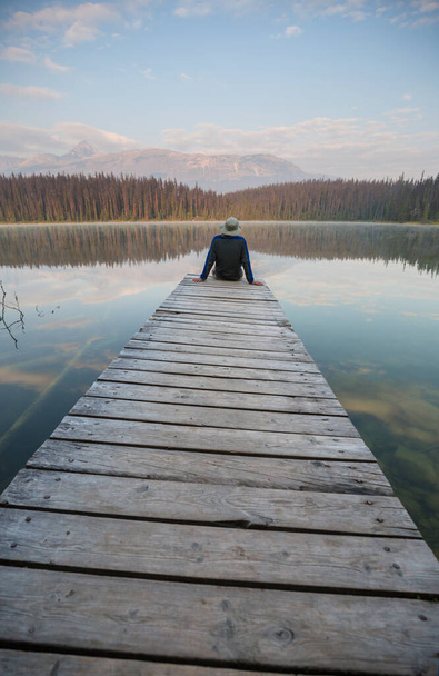 Wooden pier in serenity mountains lake - Photo, Image