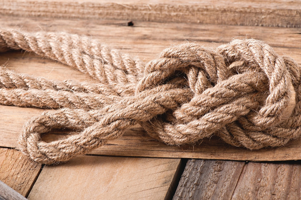 Knot on a wooden background - 写真・画像