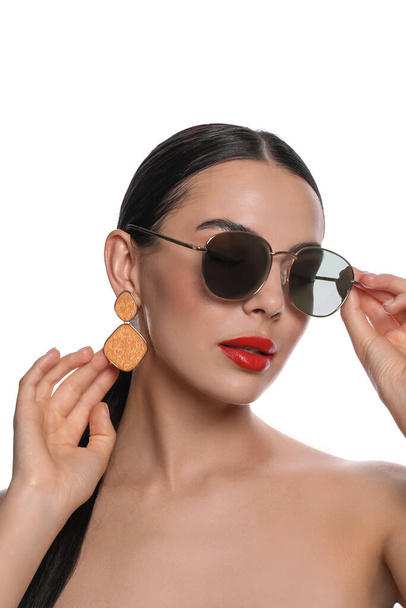 Attractive woman wearing fashionable sunglasses against white background - Zdjęcie, obraz
