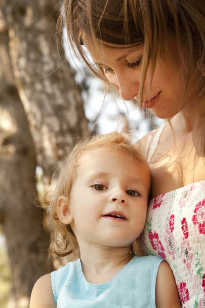 Little girl and mother in the park - Photo, image