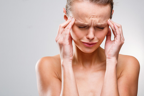 Woman suffering from acute headache - Фото, изображение