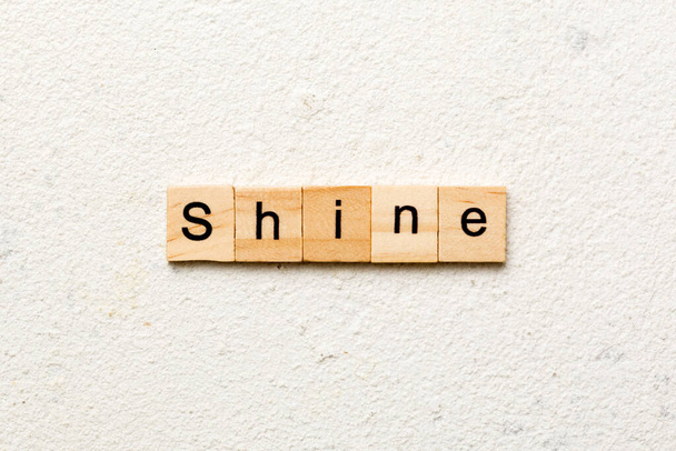 Shine word written on wood block. Shine text on cement table for your desing, concept. - Foto, Imagem