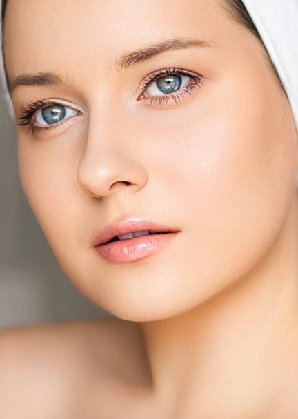 Skin care and beauty routine, beautiful woman with white towel wrapped around head, skincare cosmetics and face cosmetology, close-up portrait - 写真・画像