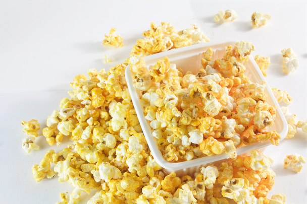 Golden popcorn in tray - 写真・画像