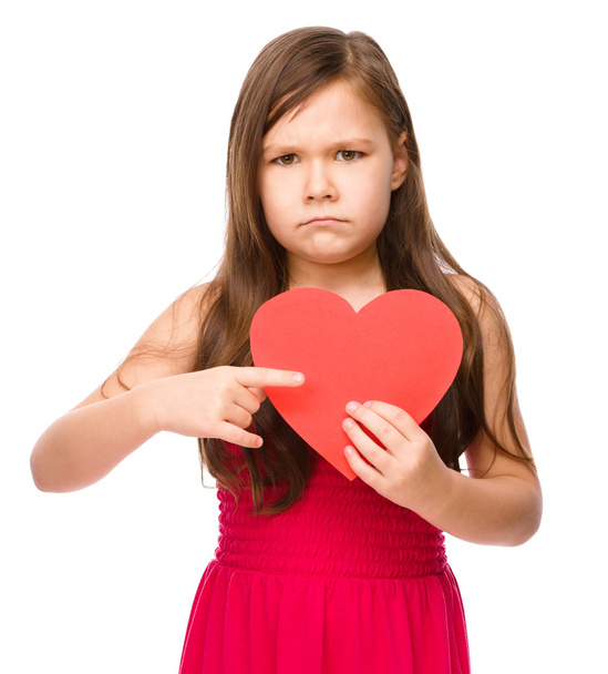 Portrait of a sad little girl in red - Foto, Bild