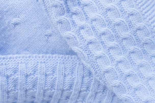 blue knitted baby blanket. baby plaid seamless pattern. pigtail knitting. three types of knitting - Valokuva, kuva