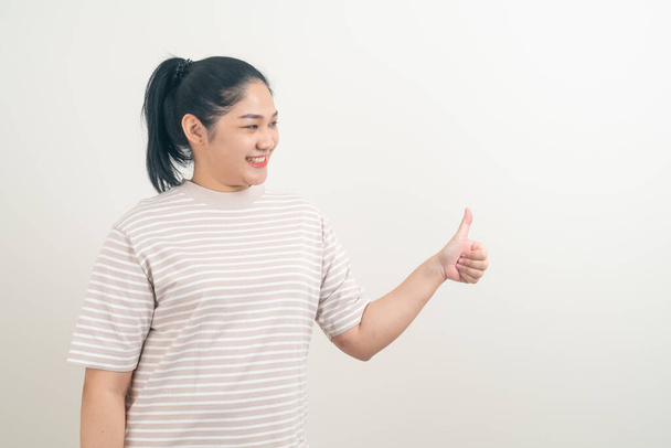 portrait Asian woman with thumb up white background - Photo, image