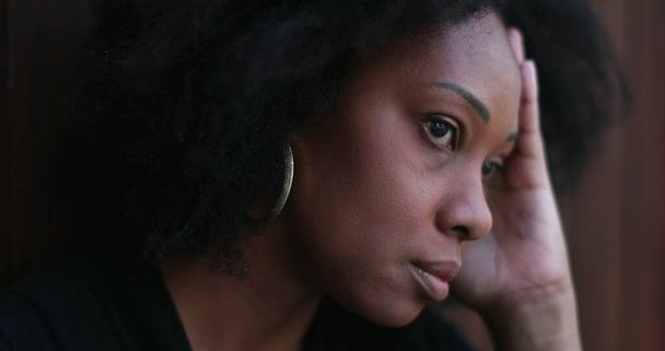 Preoccupied African woman. Pensive stressed black person feeling anxiety - Photo, image