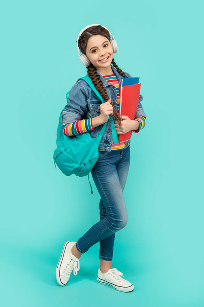 Happy teenage girl going to music school. Teenager listening to music lesson. Education in music. - Valokuva, kuva