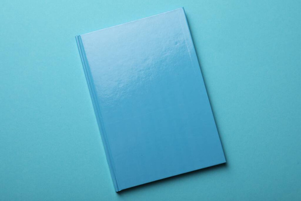New bright planner on light blue background, top view - Foto, imagen
