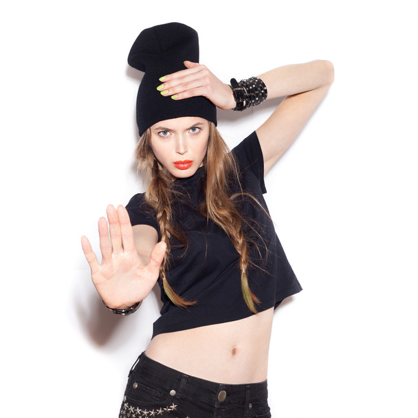 Fashion girl hipster. Swag woman in black clothes showing stop gesture - Fotoğraf, Görsel