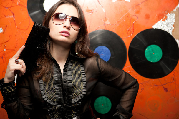 Portrait of a bright beautiful young woman with fashion sunglass - Фото, изображение