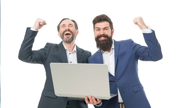 Play to win. Happy winners hold laptop isolated on white. Businessmen celebrate victory. Bearded man in make winners gesture. Winners or champions. Gaming mode. Game and entertainment. Always winners. - Fotoğraf, Görsel