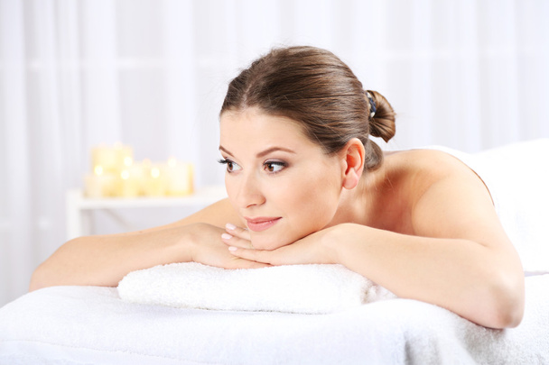 Beautiful young woman having relax in spa salon - Photo, image