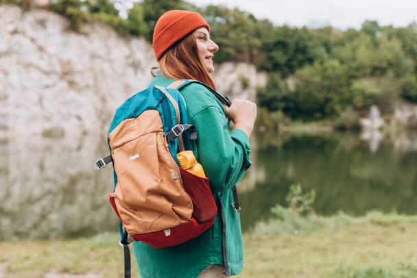Woman hiking in woods. Adventure women enjoying view of majestic mountain lake explore travel. Freedom and active lifestyle concept. Chill moment - Photo, Image
