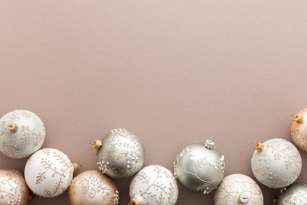 Christmas balls on powdery background, Merry Christmas and Happy New Year concept, top view, copy space - 写真・画像