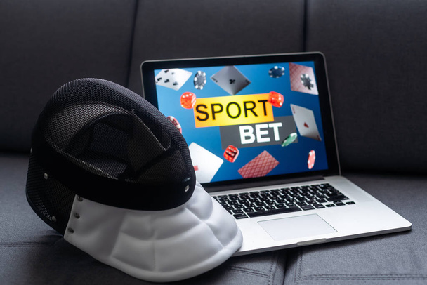 fencing, sports betting on a laptop. - Photo, Image