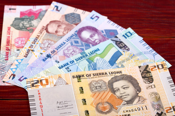 Сьерра-Леоне деньги - Леонес - бизнес фон из новой серии банкнот - Фото, изображение