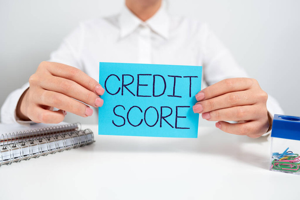 Hand writing sign Credit Score, Business concept Represent the creditworthiness of an individual Lenders rating - Photo, Image