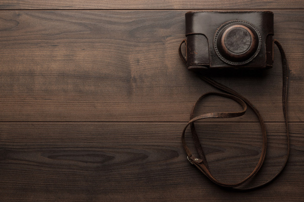 wooden background with retro still camera - Photo, Image