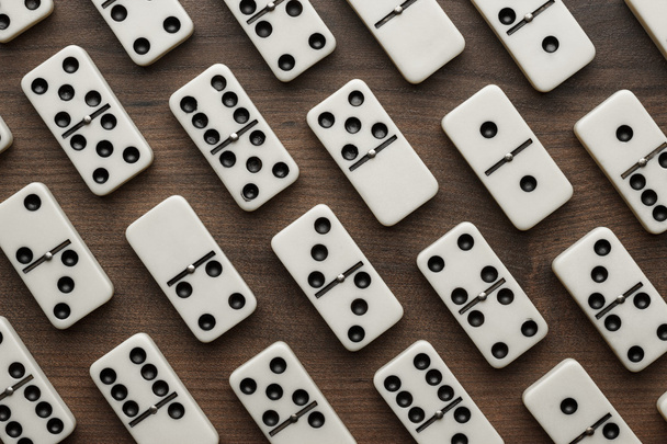 domino pieces on the wooden table background - 写真・画像