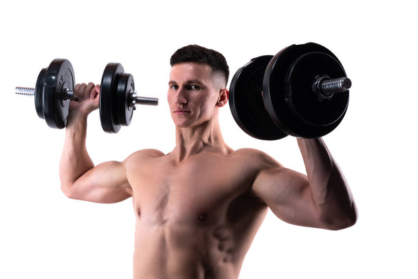 man do weightlifting in sport gym isolated on white background. gym training of weightlifting sport. muscular man with gym dumbbell do weightlifting sport. weightlifting sport in gym. - Photo, Image