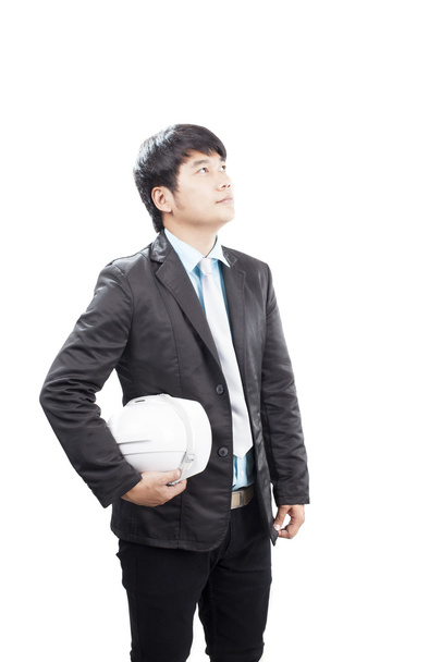 joven asiático ingeniería hombre de pie y holding seguridad casco i
 - Foto, Imagen