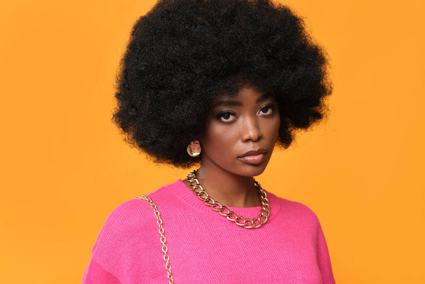 Beauty African woman on orange background. - Foto, Imagen