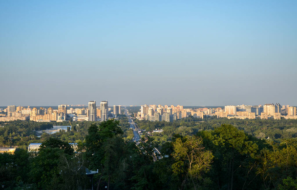 Cityscape view on the left bank of Kyiv city from the side of Park of Eternal Glory - 写真・画像