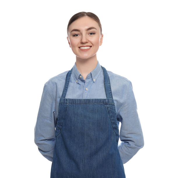 Beautiful young woman in clean denim apron on white background - Photo, image