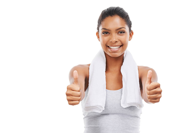 You did great today. A gorgeous young woman in sportswear giving you the thumbs up - Фото, изображение