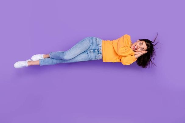 Full length photo of overjoyed positive lady lay hand under face wear stylish autumn comfort clothes isolated on purple color background. - Φωτογραφία, εικόνα