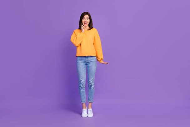 Full length photo of astonished cheerful lady stylish pullover impressed open mouth empty space isolated on purple color background. - Фото, изображение
