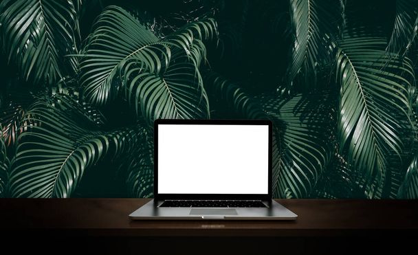 Modern laptop  isolated on green leaf background. 3D illustration. - Photo, Image
