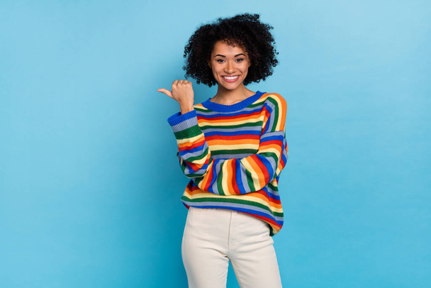 Photo of young short hairdo lady indicate promo wear colorful pullover isolated on blue color background. - Photo, image