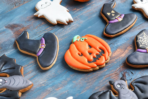 Tasty Halloween cookies on blue wooden background, closeup - Zdjęcie, obraz