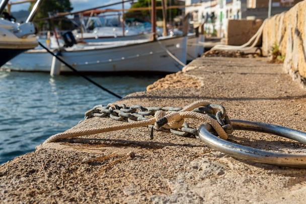 Close-up of a circular metal boat mooring in the Mallorcan town of Portocolom, Spain - Photo, image