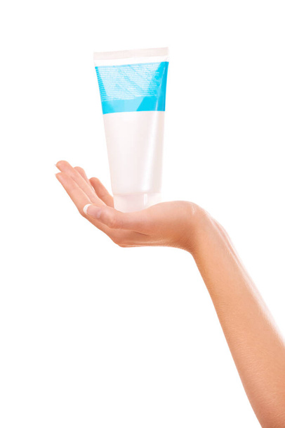 This product is great for your skin. a woman holding a tube of hand cream - Zdjęcie, obraz