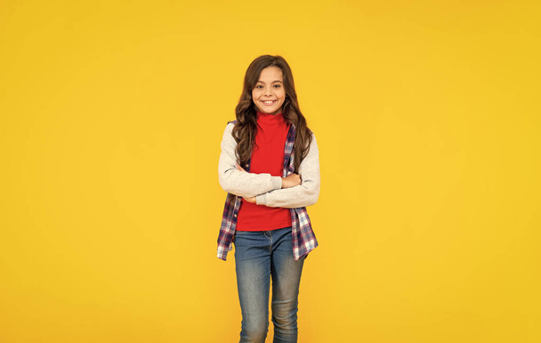 happy teen girl in casual clothes on yellow background, teeny. - Foto, Imagen