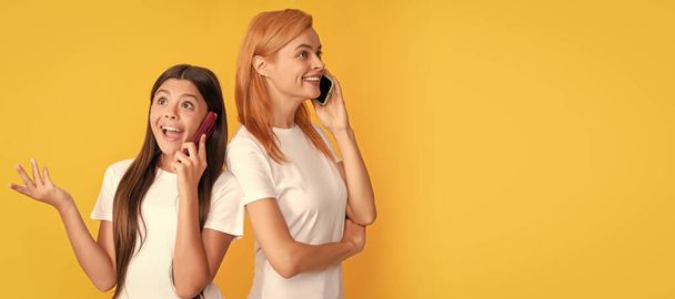Mother and daughter kid banner, copy space, isolated background. mom and kid having phone conversation. voice contact. lovely woman and girl - 写真・画像