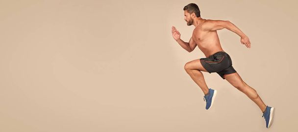 Man running and jumping, banner with copy space. sportsman man runner run to success or jump high on grey background, copy space, sport - Photo, Image
