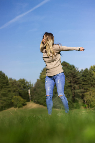 Happy woman jumping in nature - Photo, Image