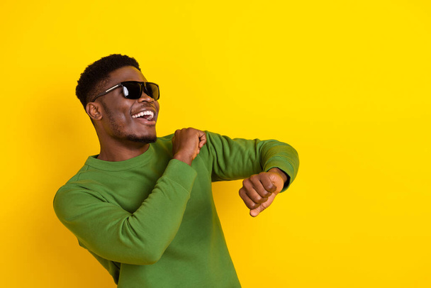 Portrait of attractive cheerful careful guy dancing having fun amusement copy space event isolated over bright yellow color background. - Foto, Imagem