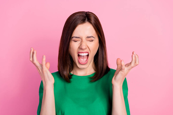 Photo of young funny angry lady screams closed eyes open mouth no menstruation isolated on pink color background. - Фото, изображение