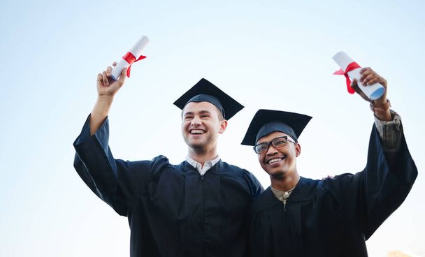 Graduate, education and students after graduation success in celebration at university or college excited for the future. Smile, friends and happy men with scholarships celebrate school certificate. - Photo, Image